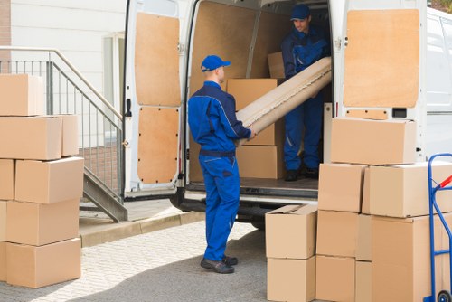Removal team working with packed boxes in Chelsea