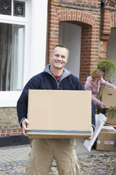 Moving team loading furniture safely into a van