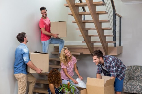 Local moving team handling boxes and household items in Chelsea