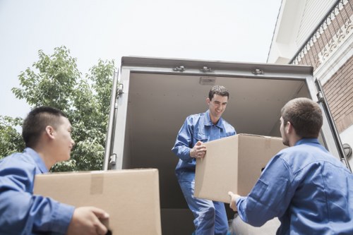 Packed moving boxes prepared for a Chelsea relocation