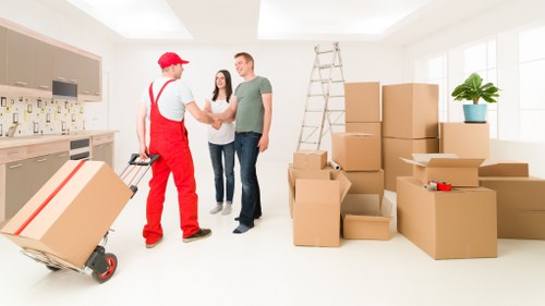 Careful loading of household items during a Chelsea home move