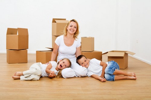 Careful packing of fragile household items by movers in Chelsea