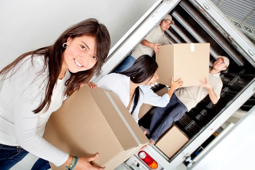 Staff handling boxes carefully during a Chelsea removal service